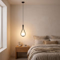 Teardrop Frame White Glass Globe Pendant Light beside a bed