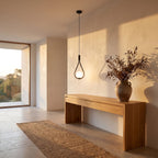 Teardrop frame glass globe pendant light in a wide entry hall view