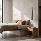 Textured Cement Cone Pendant Light beside a bed as a bedside pendant