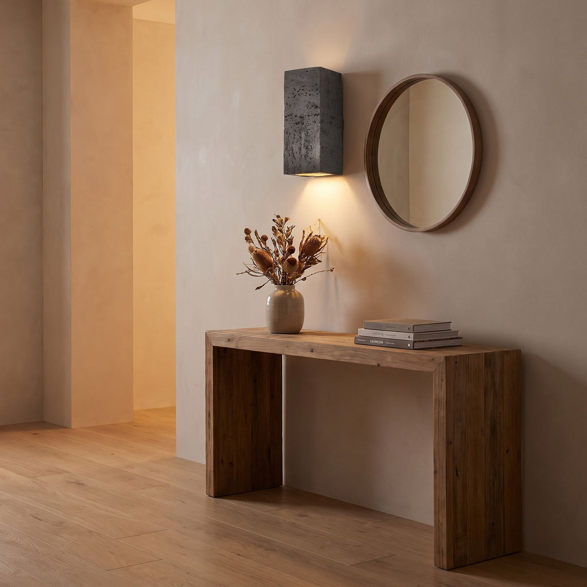 Textured Cement-Finish Box Wall Light in a hallway above a timber console