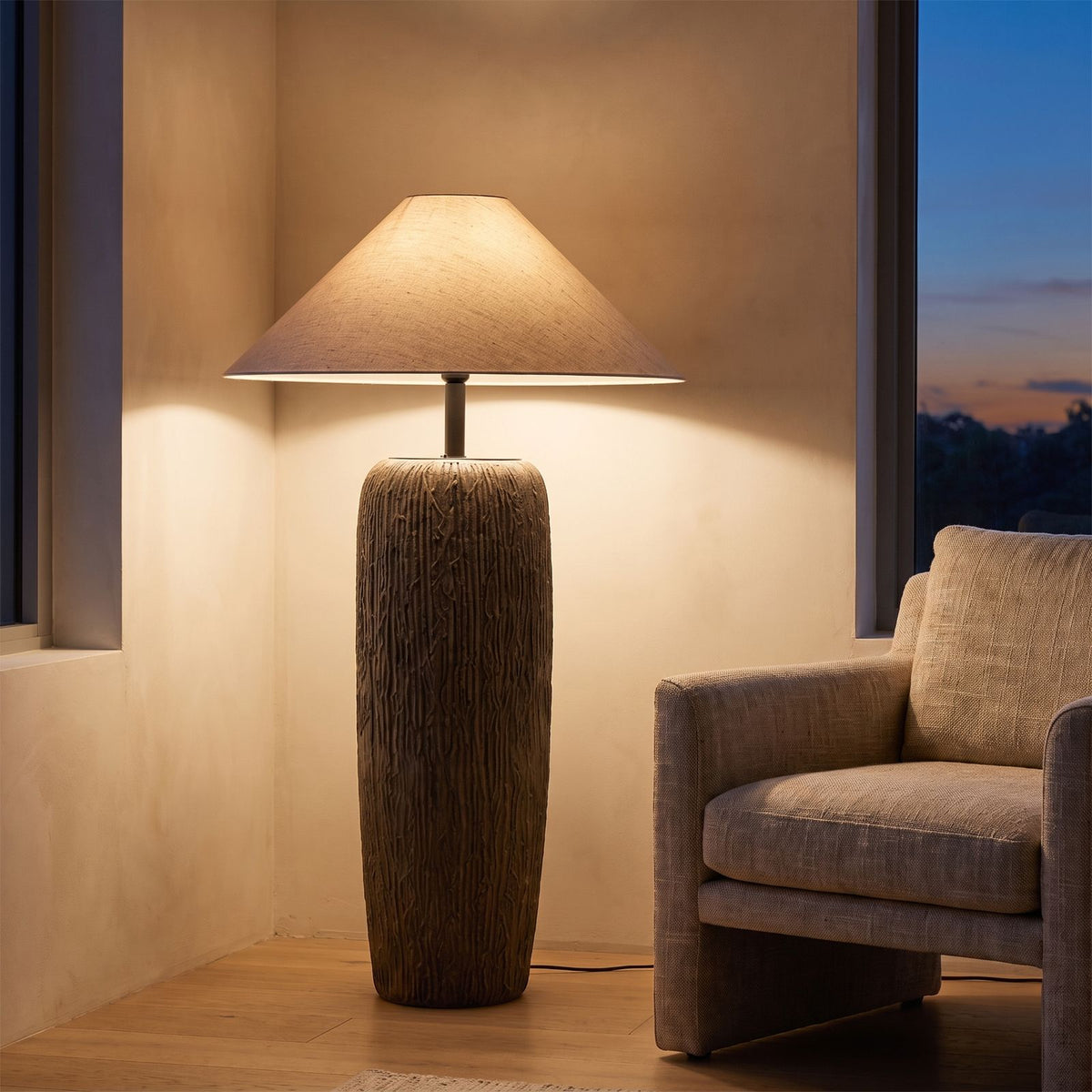 Textured Clay Base Cone Shade Floor Lamp beside an armchair in a living room corner