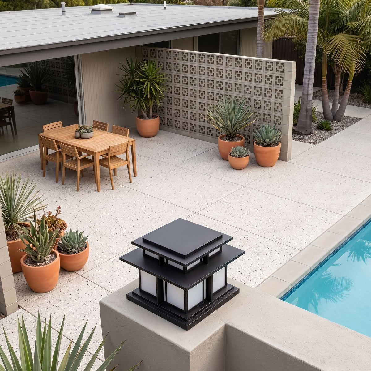 Tiered Roof Black Metal Frosted Acrylic Pillar Light on a courtyard terrace pillar in daylight