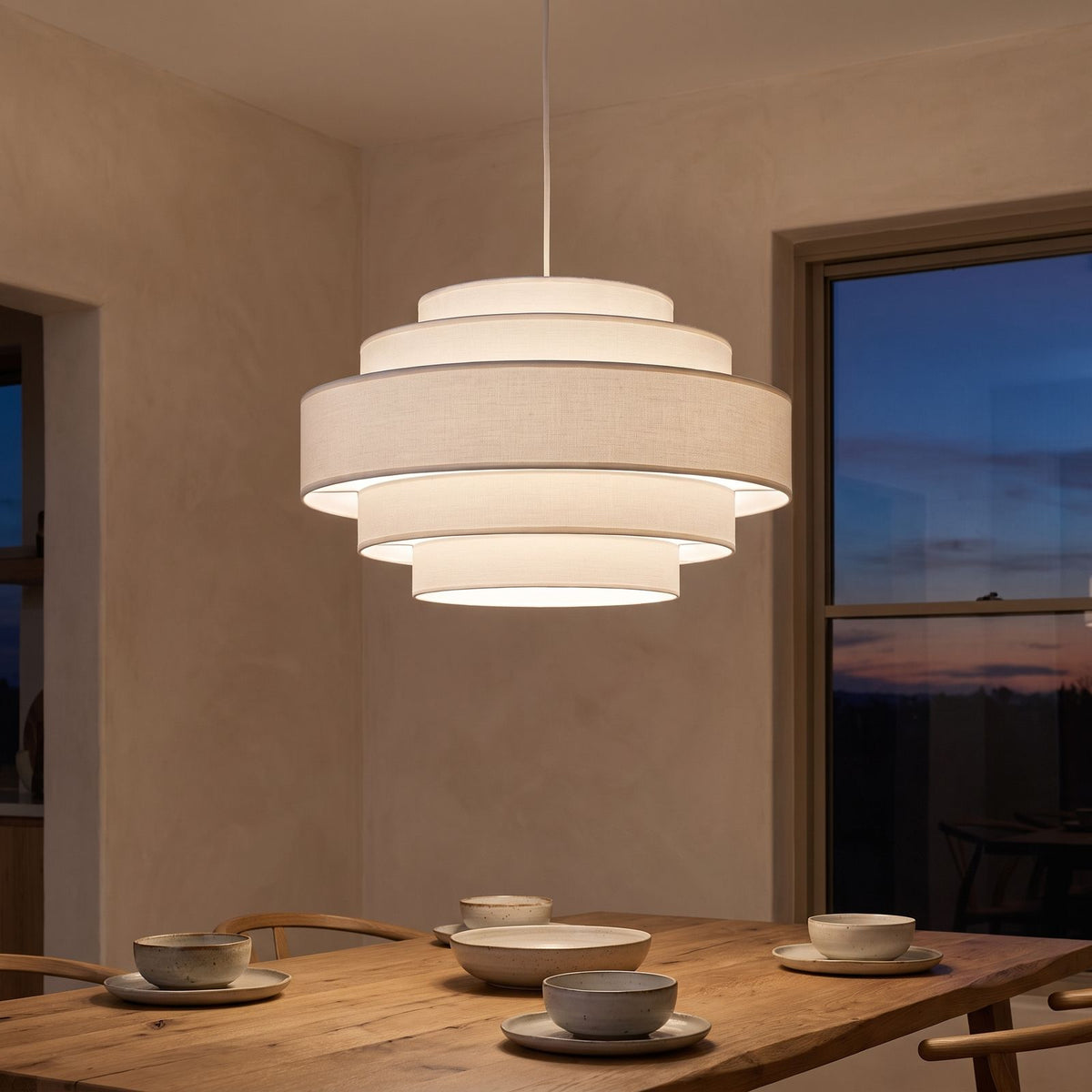 Tiered White Drum LED Pendant Light above a dining table