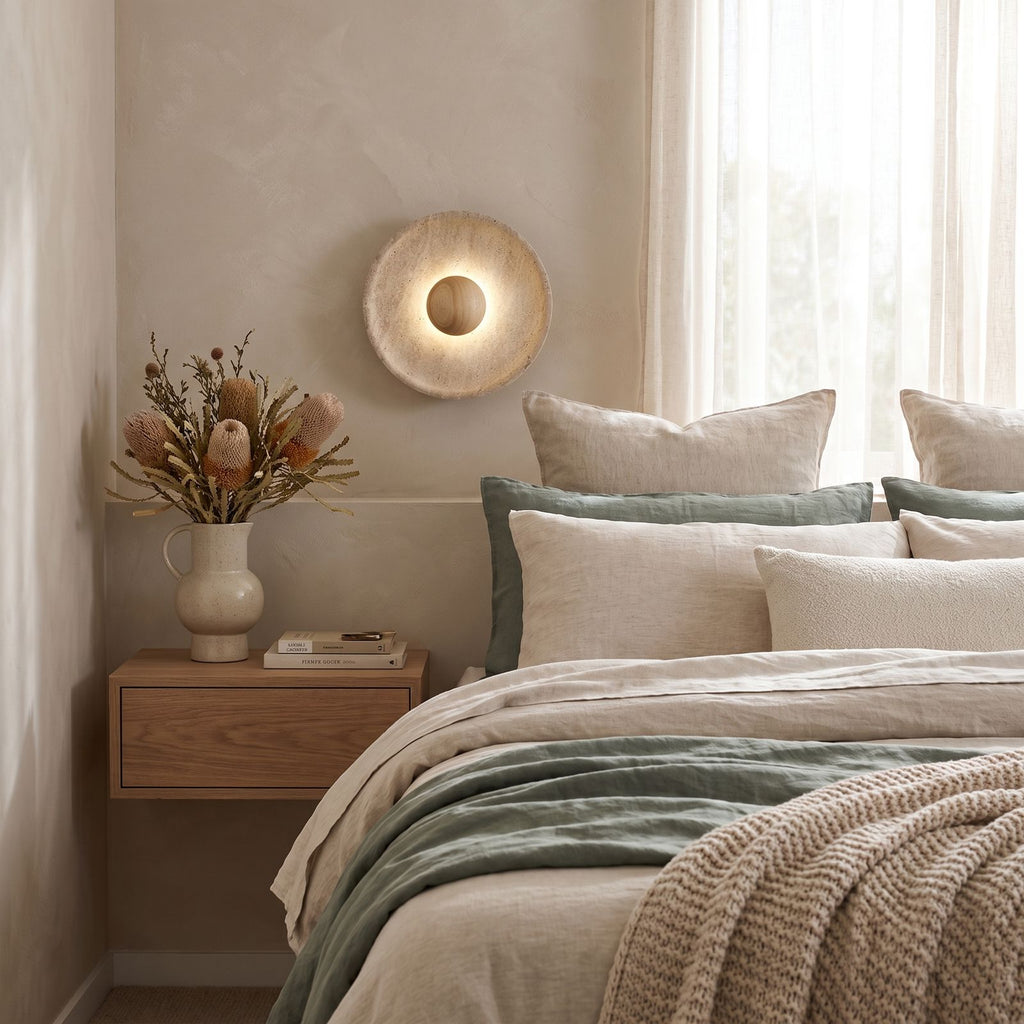 Timber Shade Travertine Wall Light on a bedroom wall beside the bed