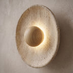 Timber Shade Travertine Wall Light, close view at 45 degrees on a plaster wall