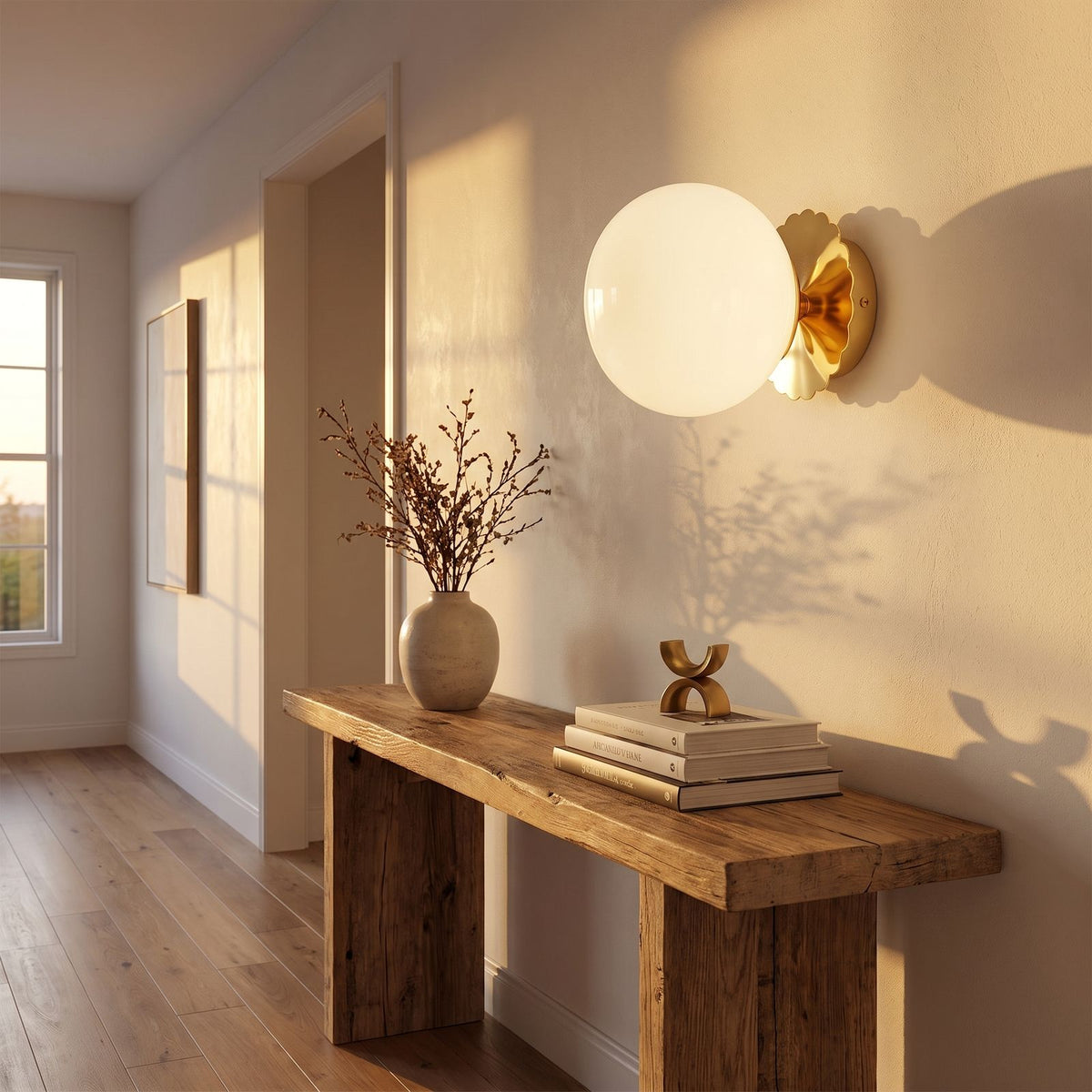 Tinted Glass Ball Up and Down Wall Light in a hallway above a timber console