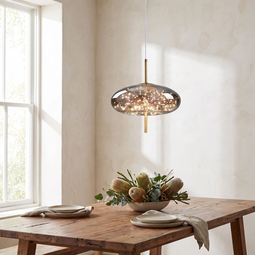 Tinted Glass Capsule and Globe Pendant Light above a timber dining table