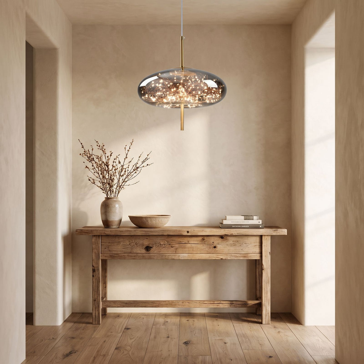 Tinted Glass Capsule and Globe Pendant Light above a console in an entry hallway