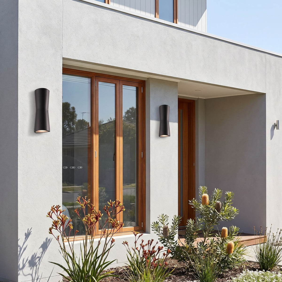 Torch Shape Acrylic Up Down Outdoor Wall Light in a pair on the facade of an Australian home