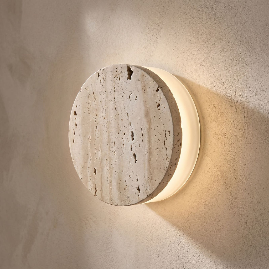 Travertine and Frosted Glass Up Down Wall Light, close view at 45 degrees on a plaster wall