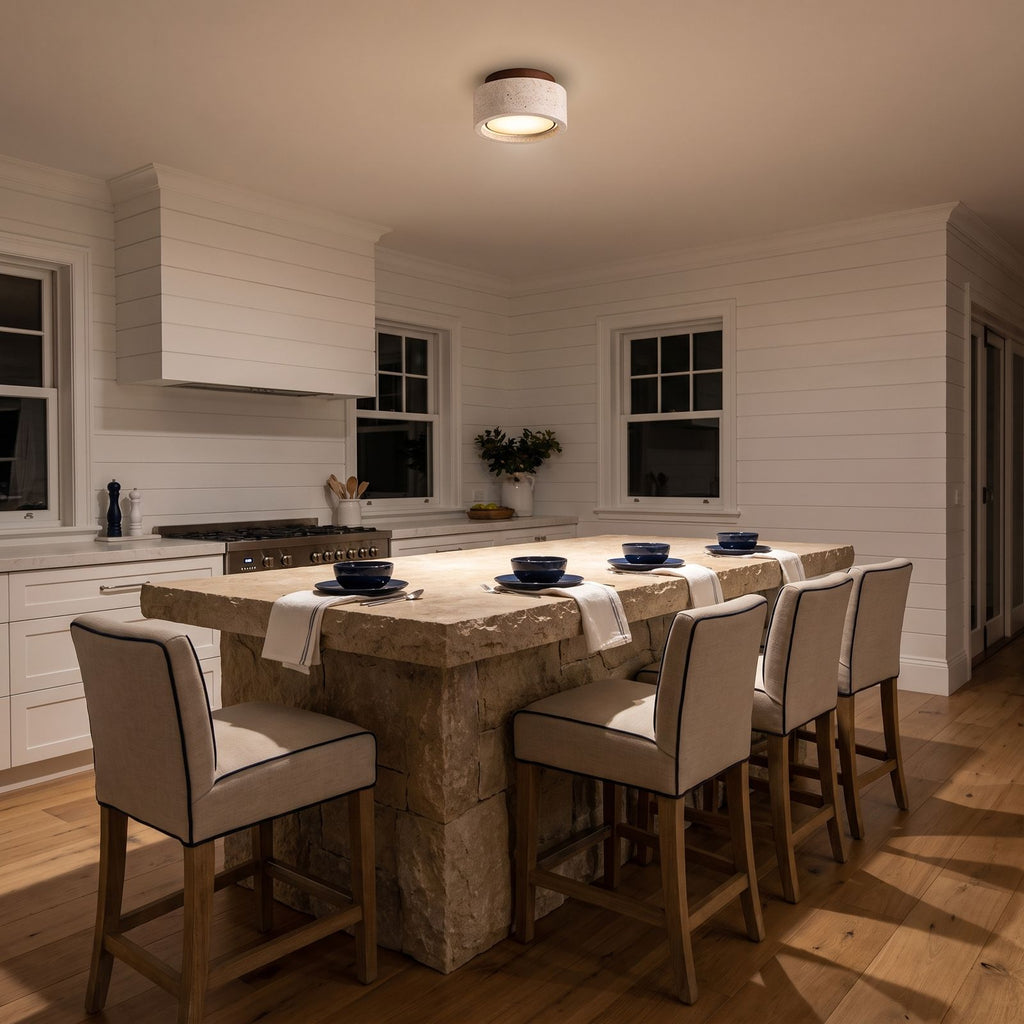 Travertine and Wood Drum Flush Mount Ceiling Light above a kitchen island at night
