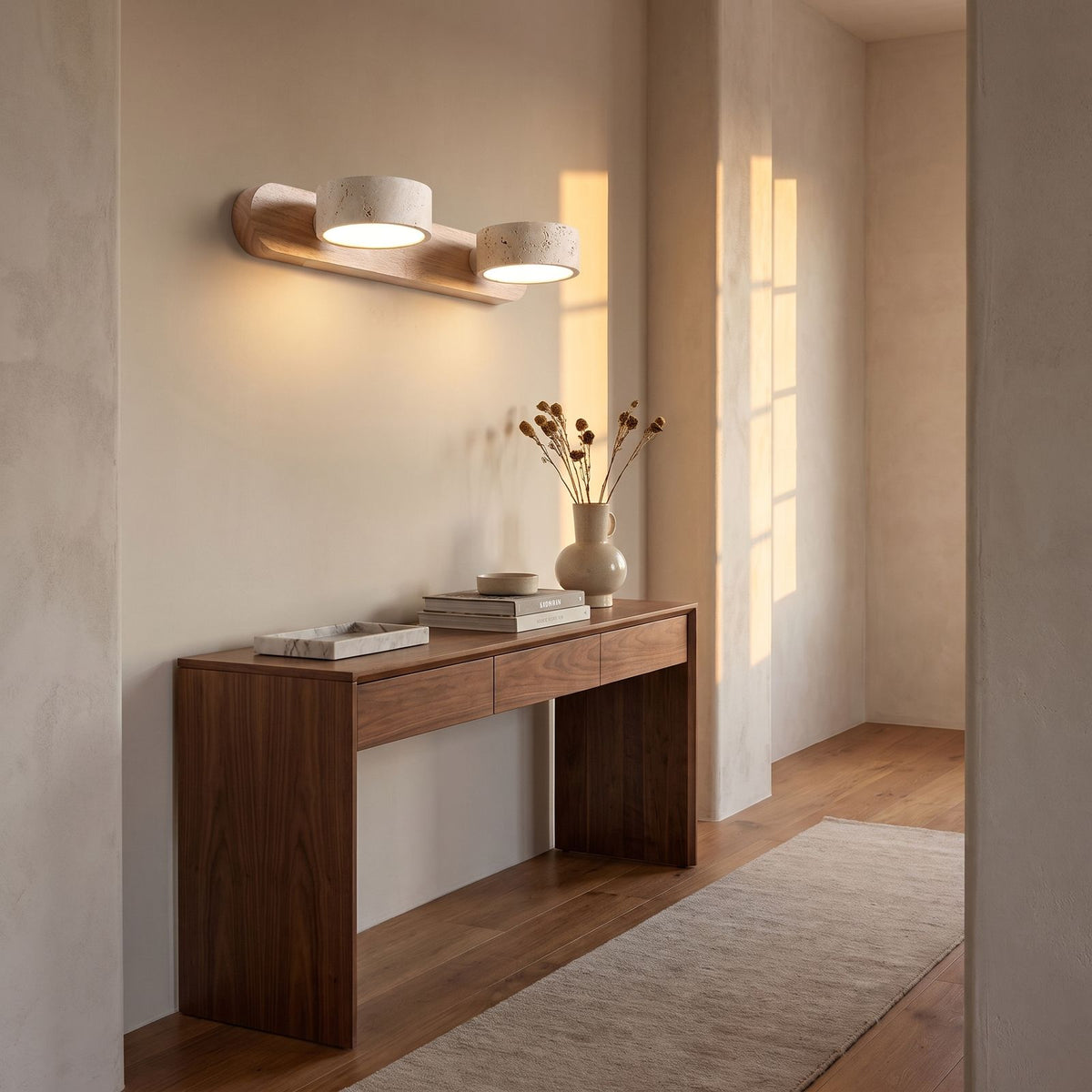 Travertine and Wood LED Vanity Wall Light in a hallway above a timber console