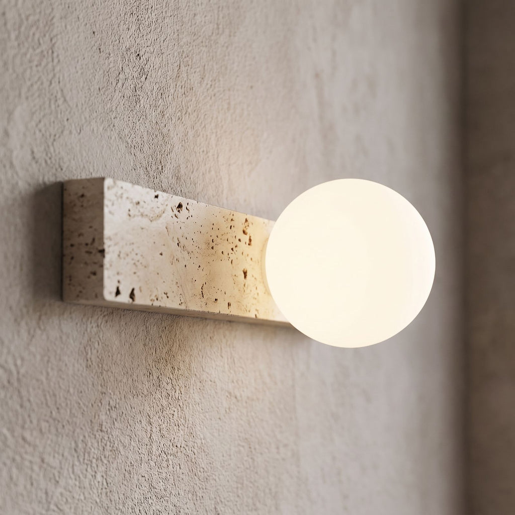 Travertine Bar and White Globe Wall Light, close view at 45 degrees on a plaster wall