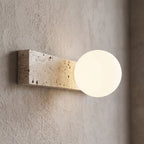 Travertine Bar and White Globe Wall Light, close view at 45 degrees on a plaster wall