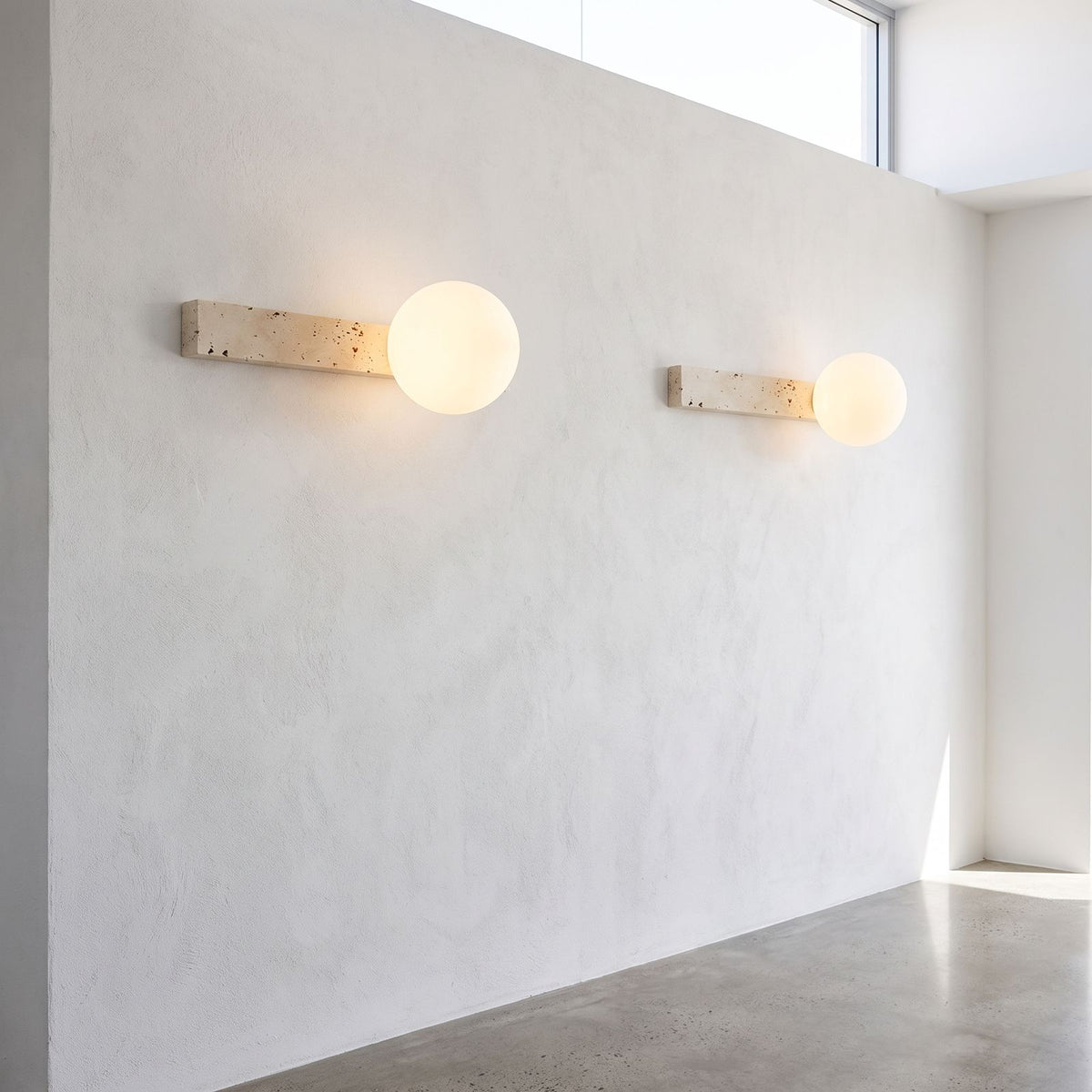 Travertine Bar and White Globe Wall Light in a pair on a wall of an Australian home