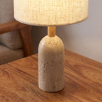 Travertine Base Fabric Shade Table Lamp, close view on a timber surface