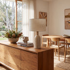 Travertine Base Fabric Shade Table Lamp on a timber sideboard in a dining room