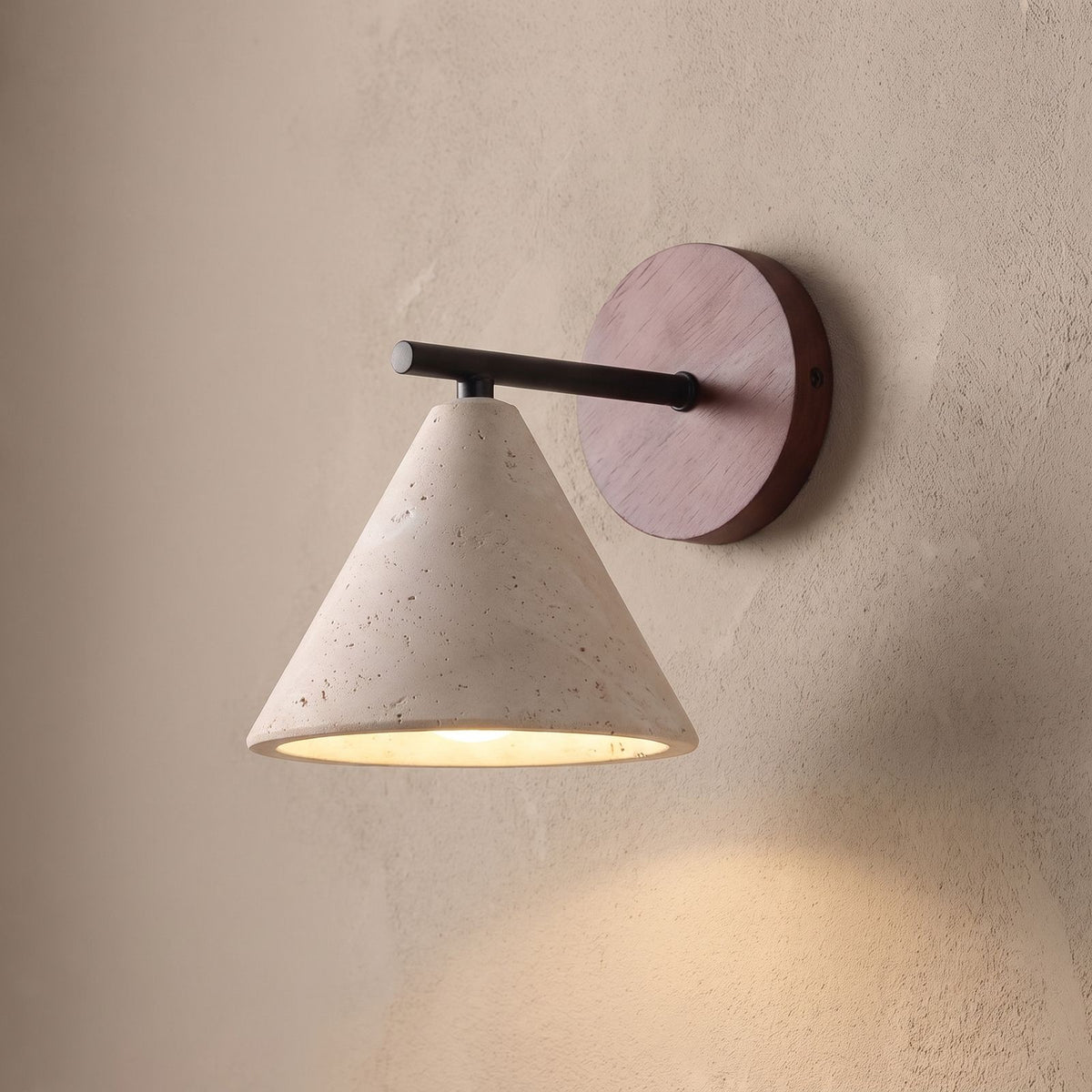 Travertine Cone and Wood Wall Light, close view at 45 degrees on a plaster wall