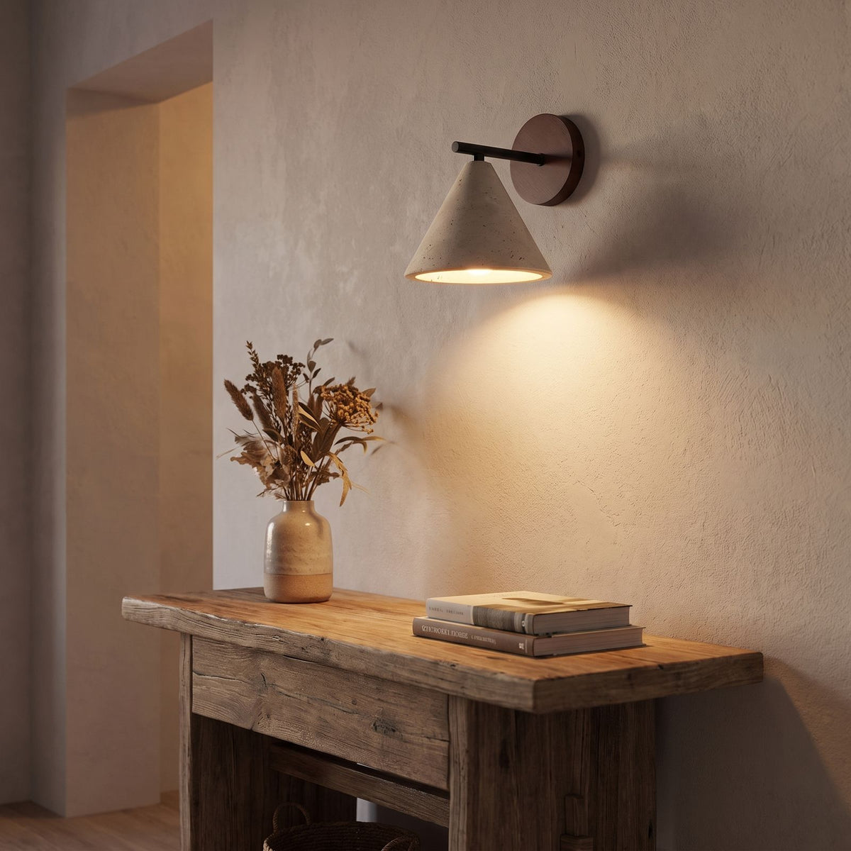 Travertine Cone and Wood Wall Light in a hallway above a timber console