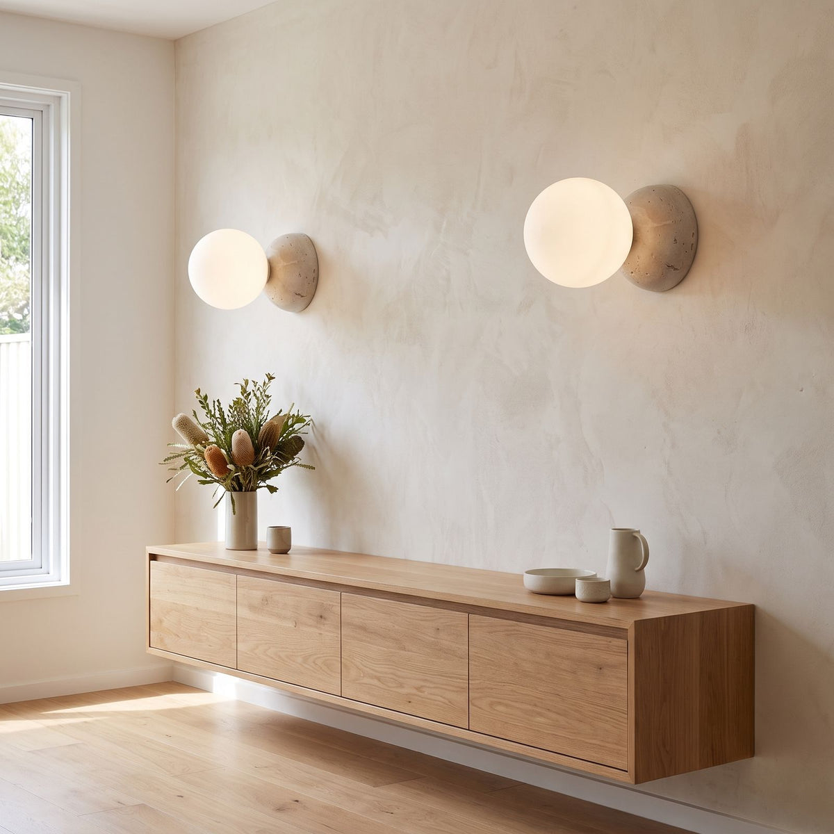 Travertine Half Dome Glass Orb Wall Light in a pair on a wall of an Australian home