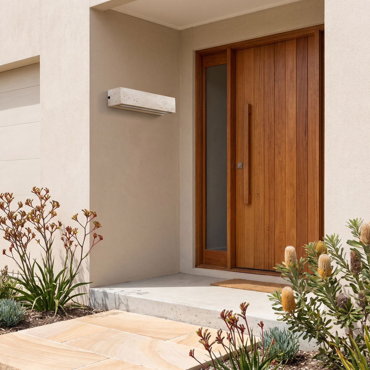 Travertine Look Resin Linear Up Down Outdoor Wall Light beside a timber front door