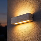 Travertine Look Resin Linear Up Down Outdoor Wall Light on a porch wall at dusk