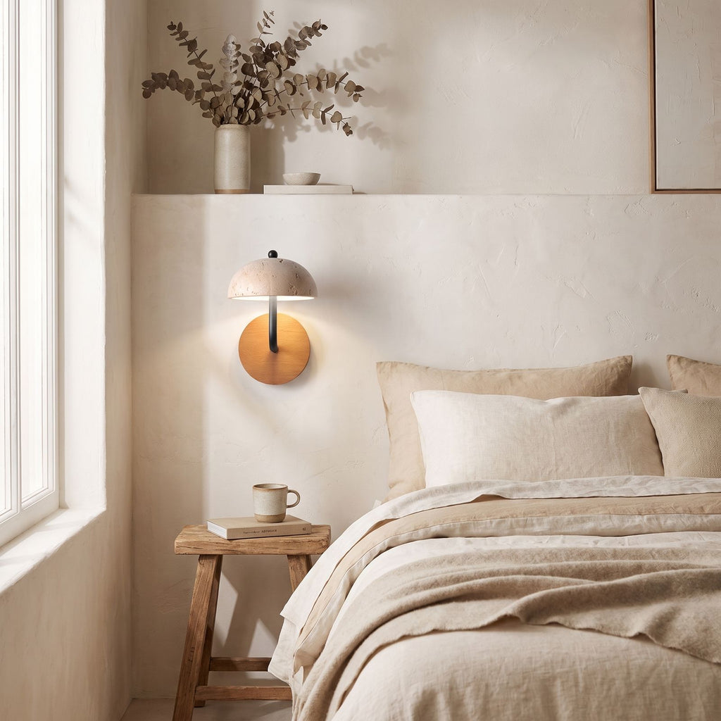 Travertine Mushroom Dome Bedside Wall Light on a bedroom wall beside the bed