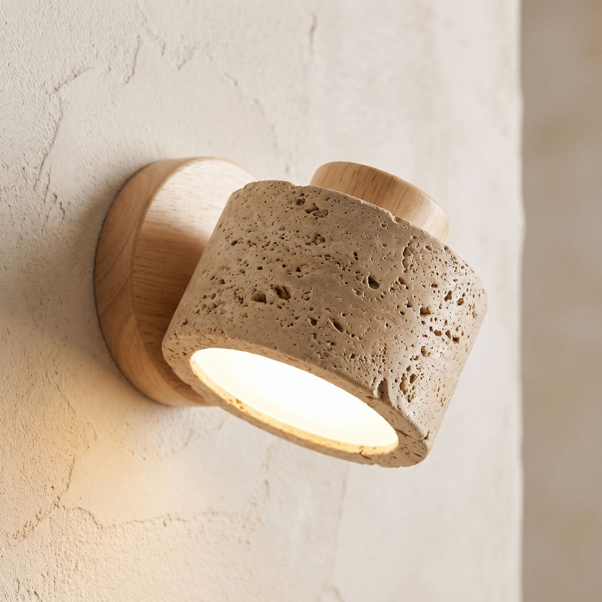 Travertine Stone Reading Wall Light, close view at 45 degrees on a plaster wall