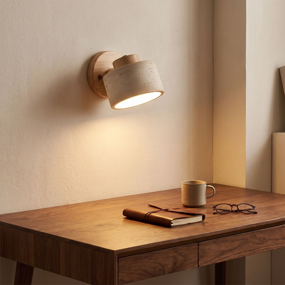 Travertine Stone Reading Wall Light in a hallway above a timber console