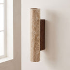 Travertine Tube Up Down Wall Light on a plaster wall in daylight