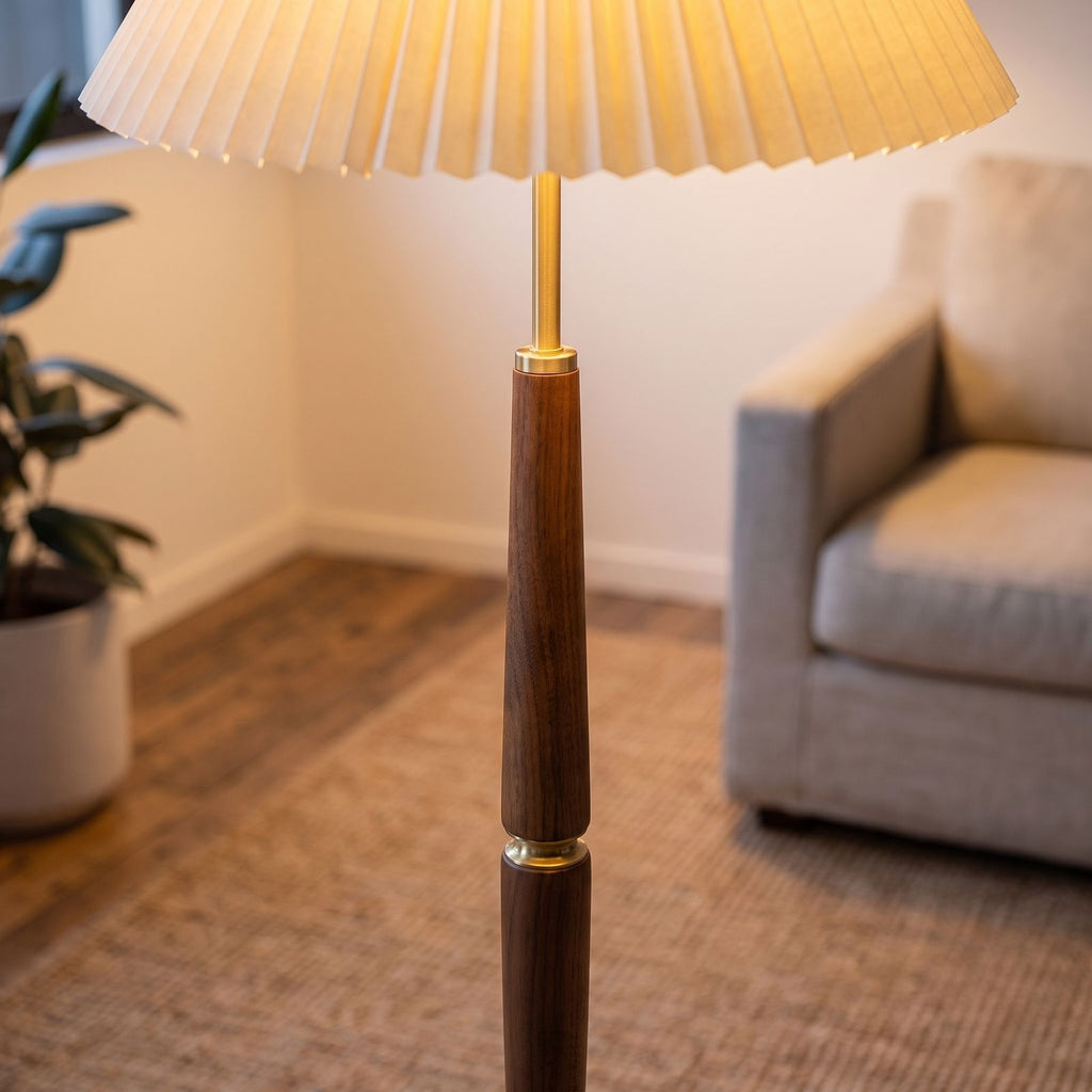 Close-up of the turned wood stem, gold-tone rings and pleated shade