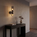 Twin Coloured Glass Shade Wall Light in a hallway above a timber console