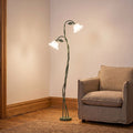 Twisted Green Stem Flower Shade Floor Lamp beside an armchair in a living room corner