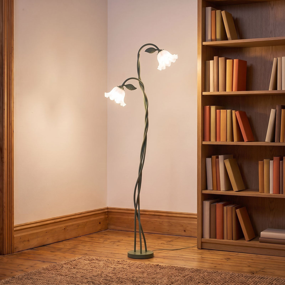 Green stem flower shade floor lamp in a reading corner beside a bookshelf