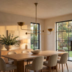 Two Arm Bowl Shade and Ball Chandelier above a dining table at golden hour