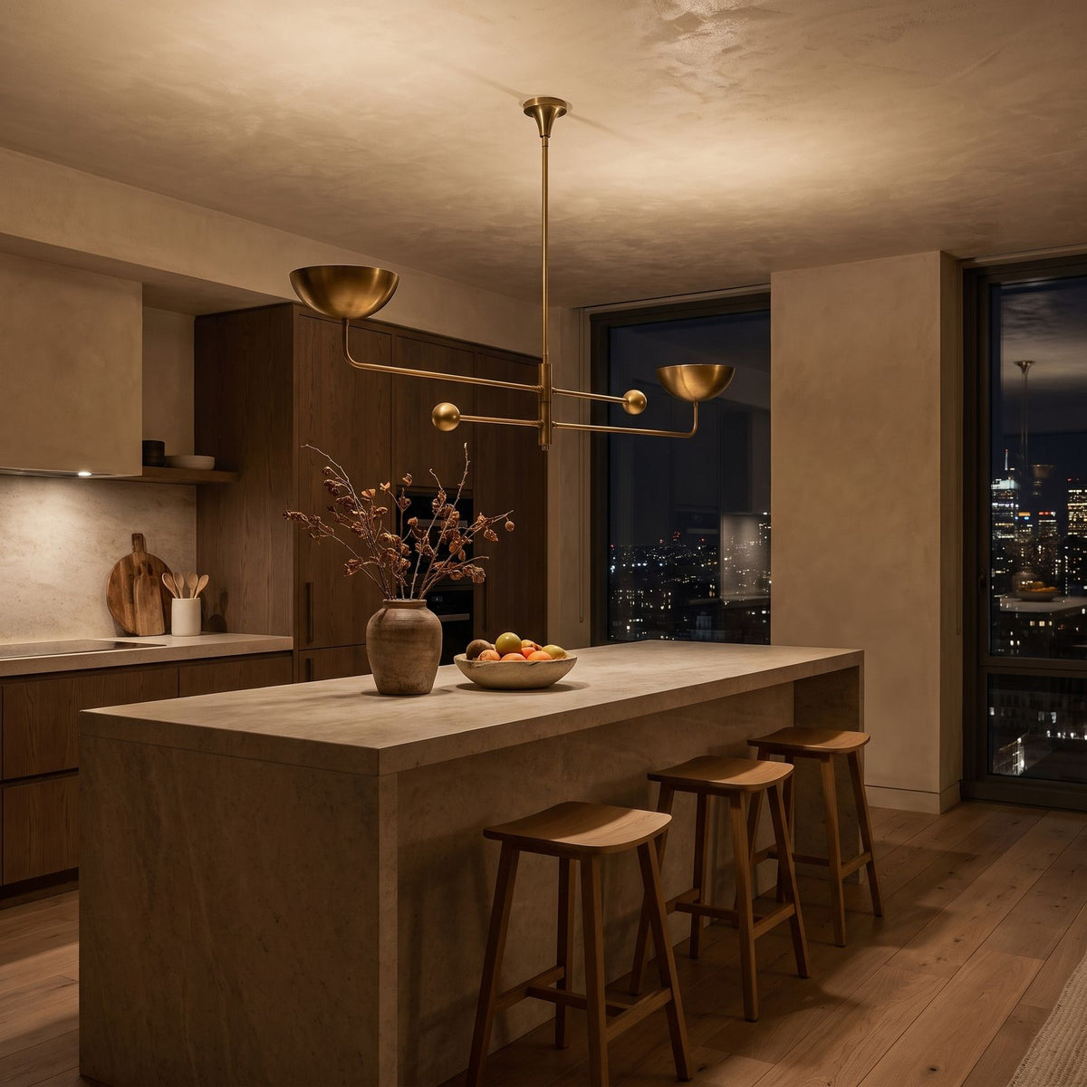 Two Arm Bowl Shade and Ball Chandelier above a kitchen island at night