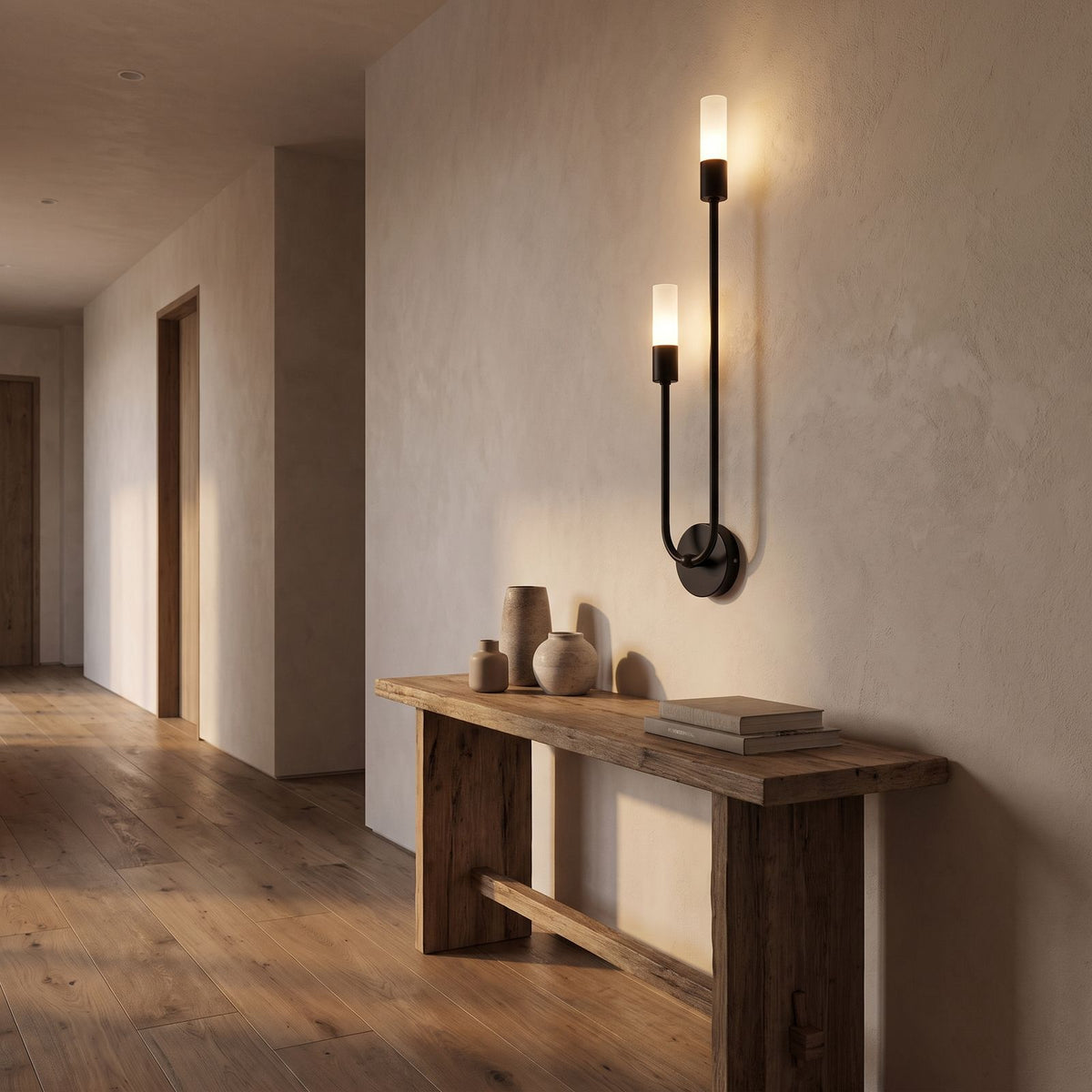 Two-Arm Iron and Acrylic Tube Wall Light in a hallway above a timber console