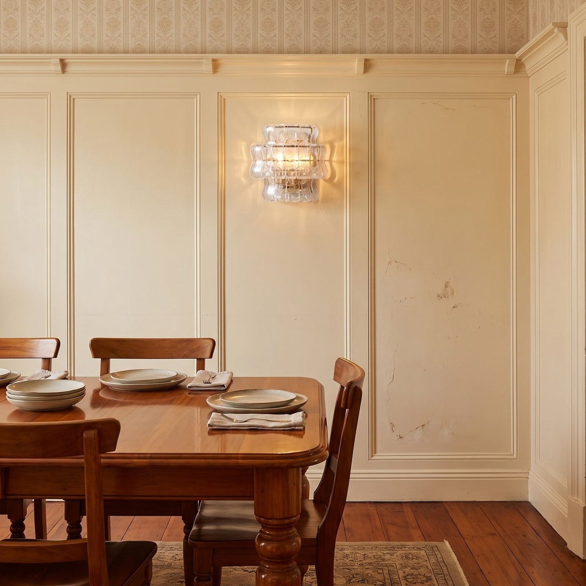 Two Tier Fluted Glass Brass Wall Sconce on a dining room wall