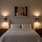 A pair of Two Tone Double Head Iron Wall Lights either side of a bedhead