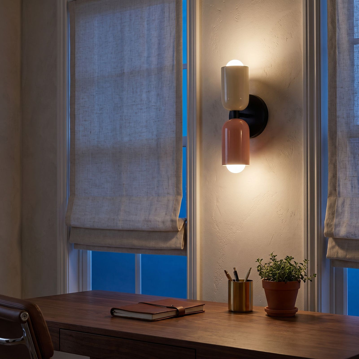 Two Tone Double Head Iron Wall Light above a walnut desk