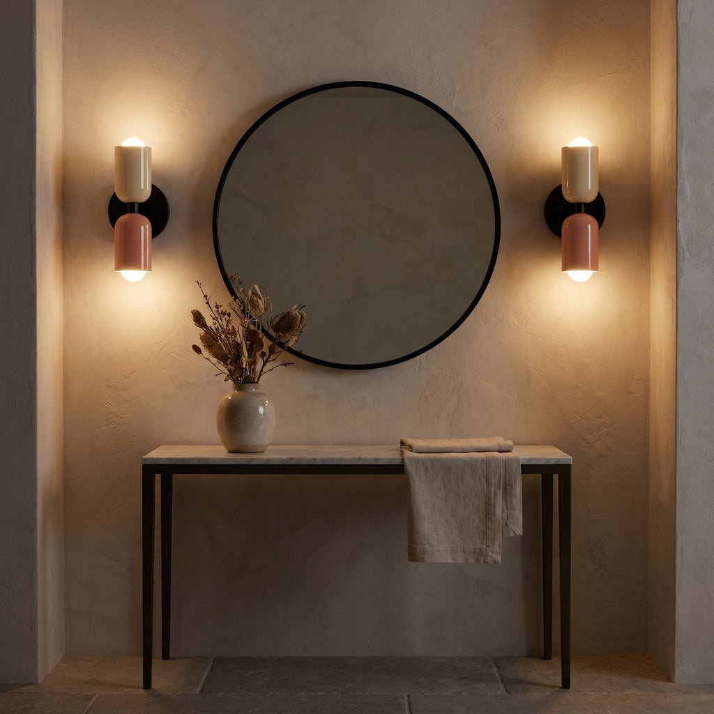 A pair of Two Tone Double Head Iron Wall Lights either side of a round mirror