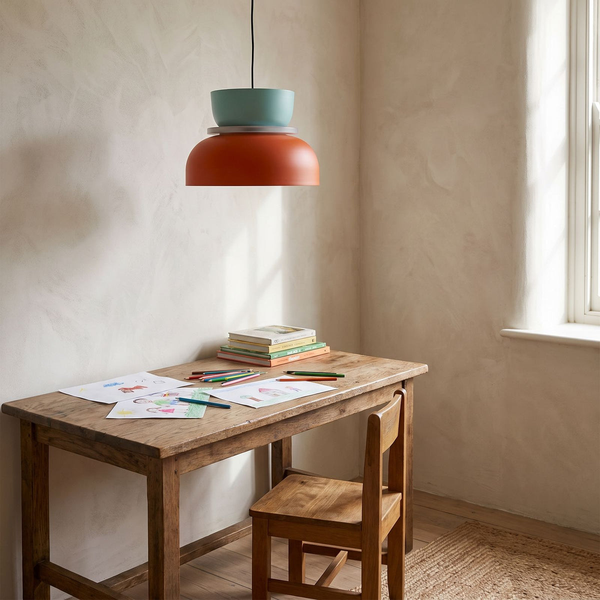 Two-Tone Stacked Metal Bowl Pendant Light above a desk in a study corner
