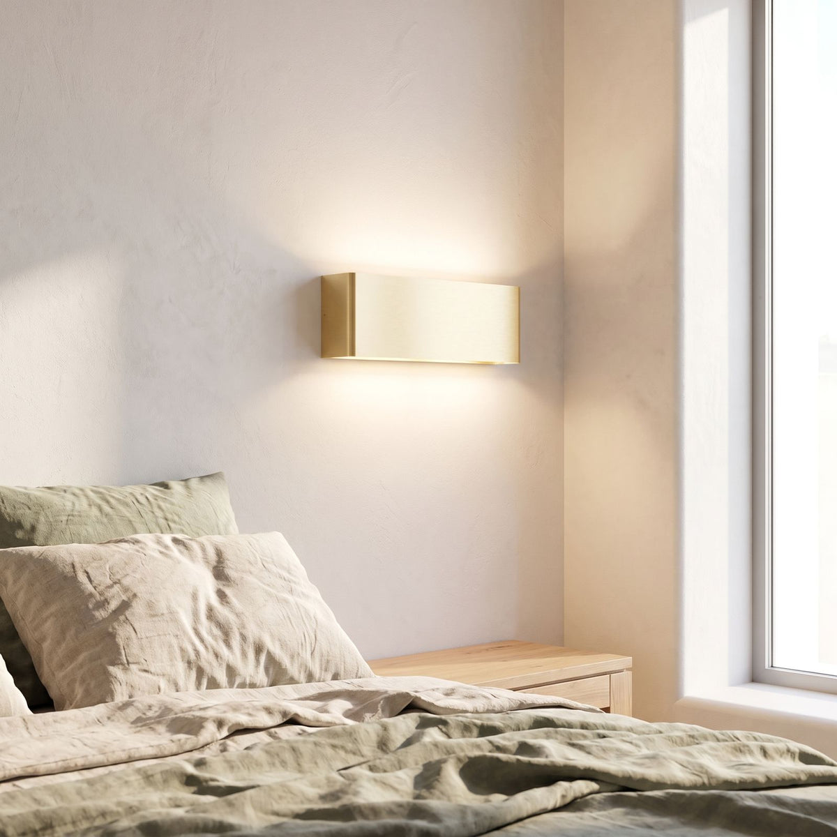 Ultra-thin up down LED wall light beside a bed in daylight