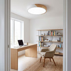 White ultra thin LED oyster ceiling light above a desk in a home office