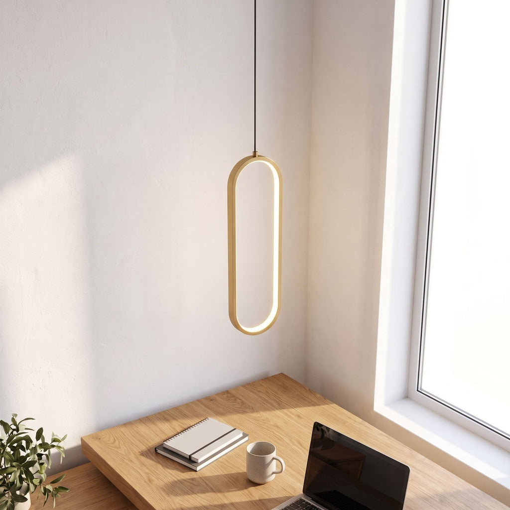 Vertical oval ring LED pendant light above a home office desk in daylight