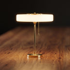 Vintage Metal and Acrylic Three-Light Table Lamp, close view on a timber surface