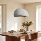 Wabi Sabi Fibreglass Resin Pendant Light above a timber dining table