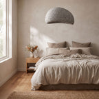 Wabi Sabi Fibreglass Resin Pendant Light above a bed