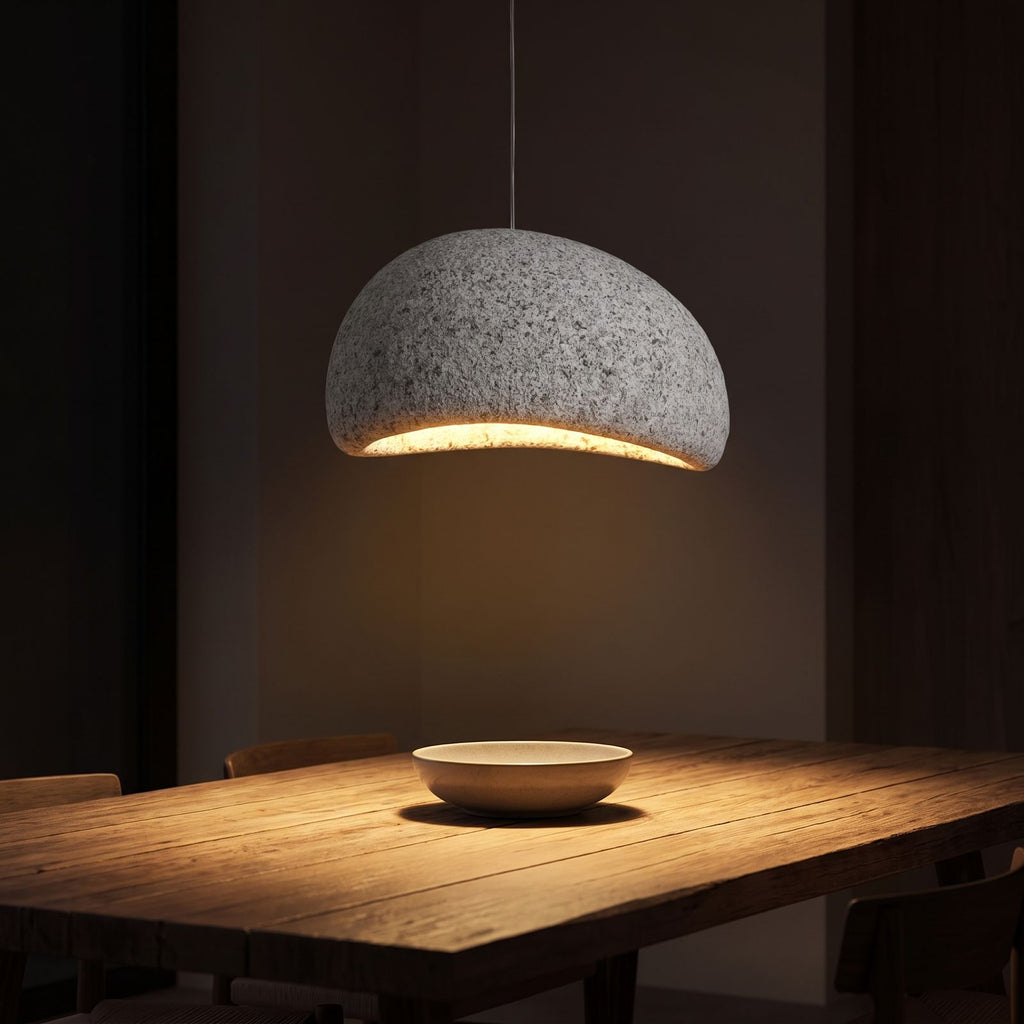 Wabi Sabi Fibreglass Resin Pendant Light above a dining table at night