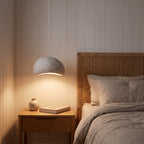 Wabi Sabi pendant hanging low beside a bed